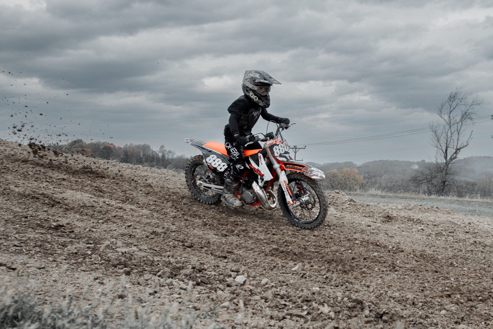 A daring motorcyclist powers through a dirt track in Pennsylvania, capturing the essence of off-road biking excitement.